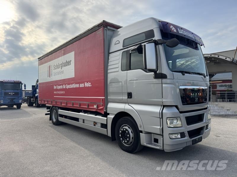 MAN TGX 18.360 ADR Curtainsider trucks